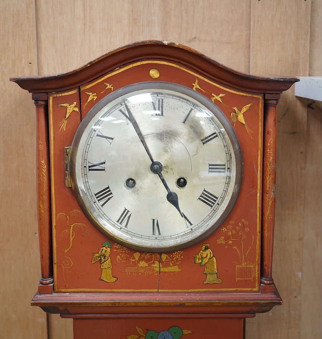 A 1930's Japanned grandmother clock with Roman numeral dial. Condition - poor, cracked and chipped